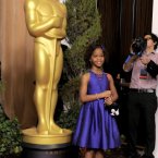 Thank God for Quvenzhané and her doggy handbag, a little cute goes a long way. (Chris Pizzello/Invision/AP)