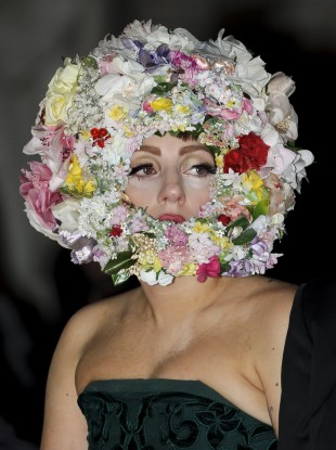 Presumably the crown of flowers is to soften the stench.