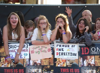 One Direction fans, probably tweeting.