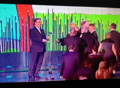 Chris Noth, aka Mr Big, waits to present the award to Brendan O'Carroll. 