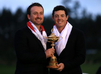 Golfers Rory McIlroy and Graeme McDowell celebrate Europe's Ryder Cup win