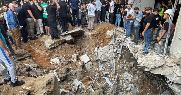 Israel says top Hezbollah commander among 12 people killed in strike on Beirut