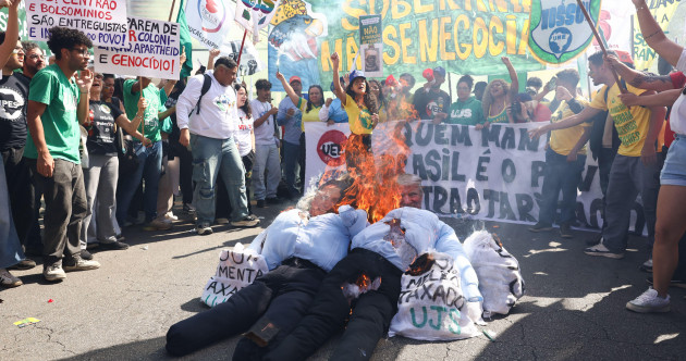 Brazilians burn effigies of Donald Trump over punishing new tariff
